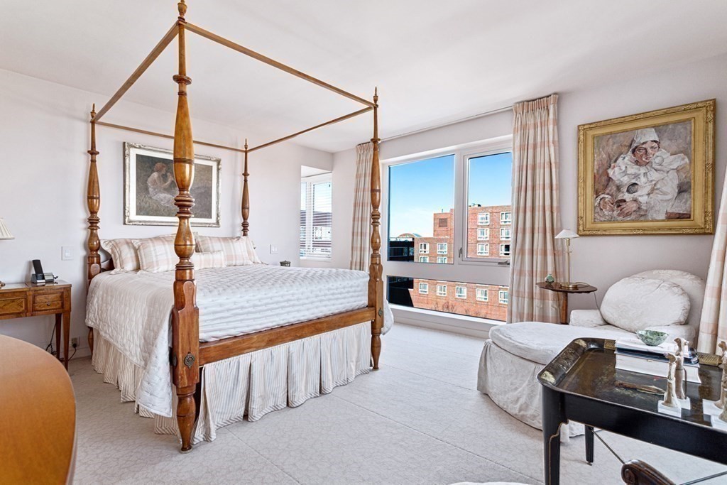 975 Memorial Drive, Unit 906 Cambridge, MA 02138 - Photo 16 of 37 a bedroom with furniture and a window