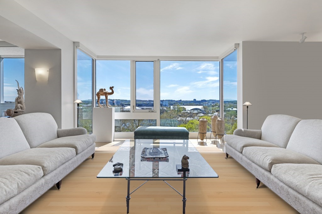 975 Memorial Drive, Unit 906 Cambridge, MA 02138 - Photo 2 of 37 a living room with furniture and a large window