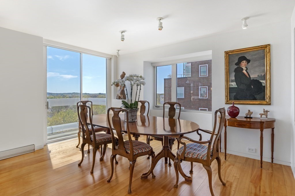 975 Memorial Drive, Unit 906 Cambridge, MA 02138 - Photo 5 of 37 a dining room with furniture and window