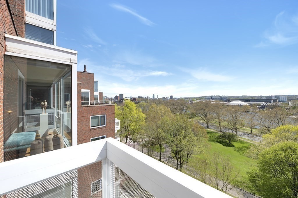 975 Memorial Drive, Unit 906 Cambridge, MA 02138 - Photo 6 of 37 a view of a lake from a balcony