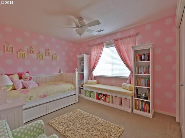 4920 Northwest 146th Place Portland, OR 97229 - Photo 11 of 16 a bedroom with a bed furniture and a window