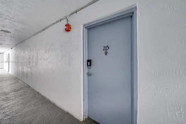 a view of a room that has a table and chair