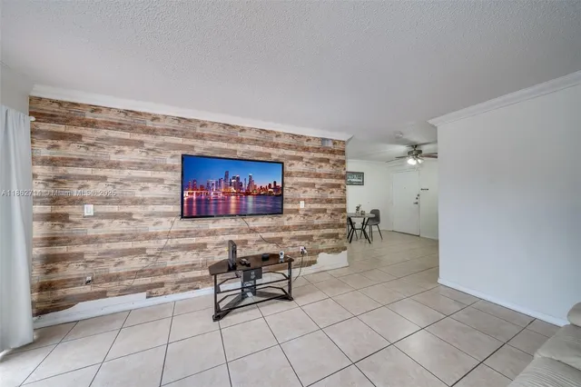 a view of swimming pool with outdoor seating and plants