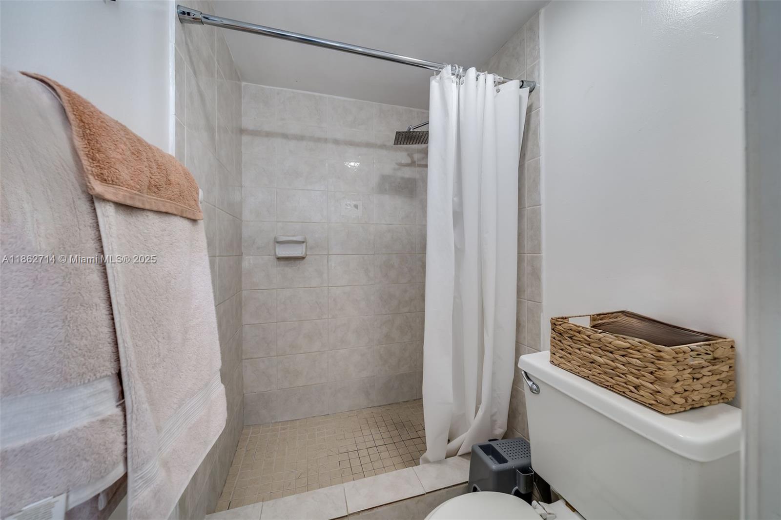 1221 Southwest 122nd Avenue, Unit 215 Miami, FL 33184 - Photo 31 of 57 a bathroom with a shower and a sink