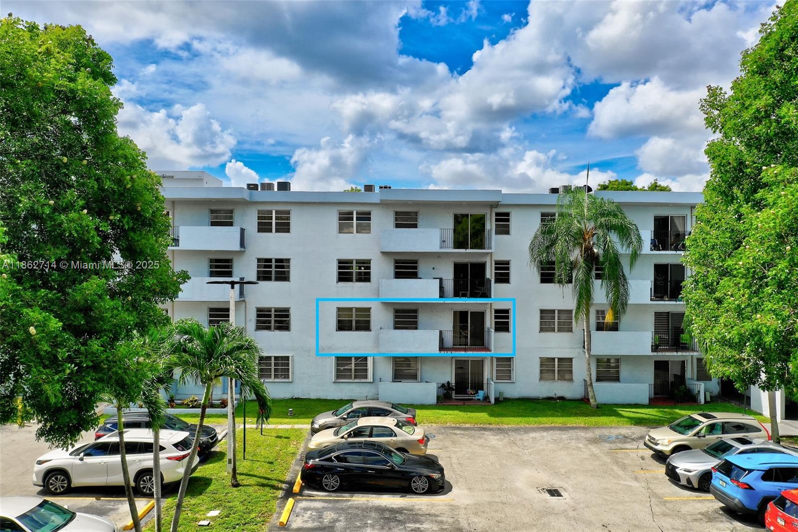 1221 Southwest 122nd Avenue, Unit 215 Miami, FL 33184 - Photo 41 of 57 a car parked in front of a building