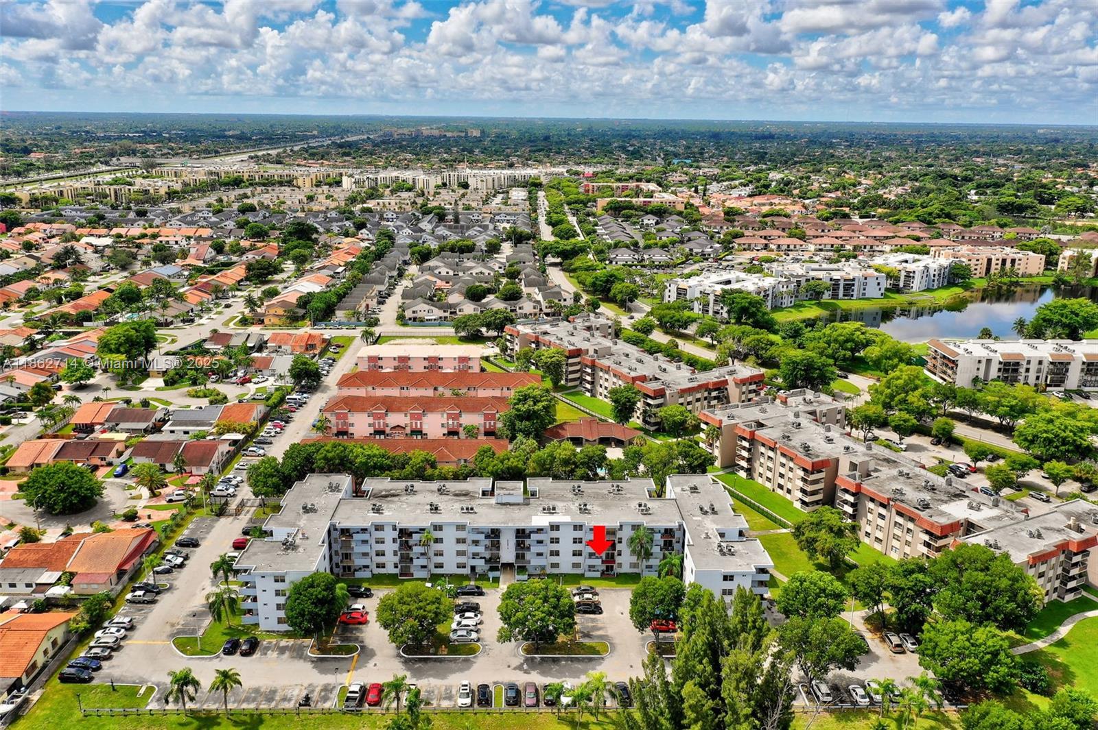 1221 Southwest 122nd Avenue, Unit 215 Miami, FL 33184 - Photo 43 of 57 an aerial view of residential houses and outdoor space