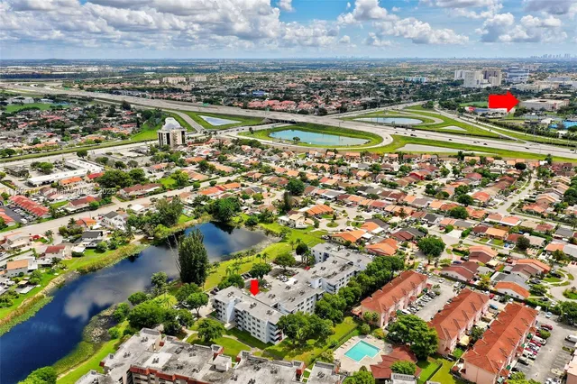 a view of a city with lots of plants and water view