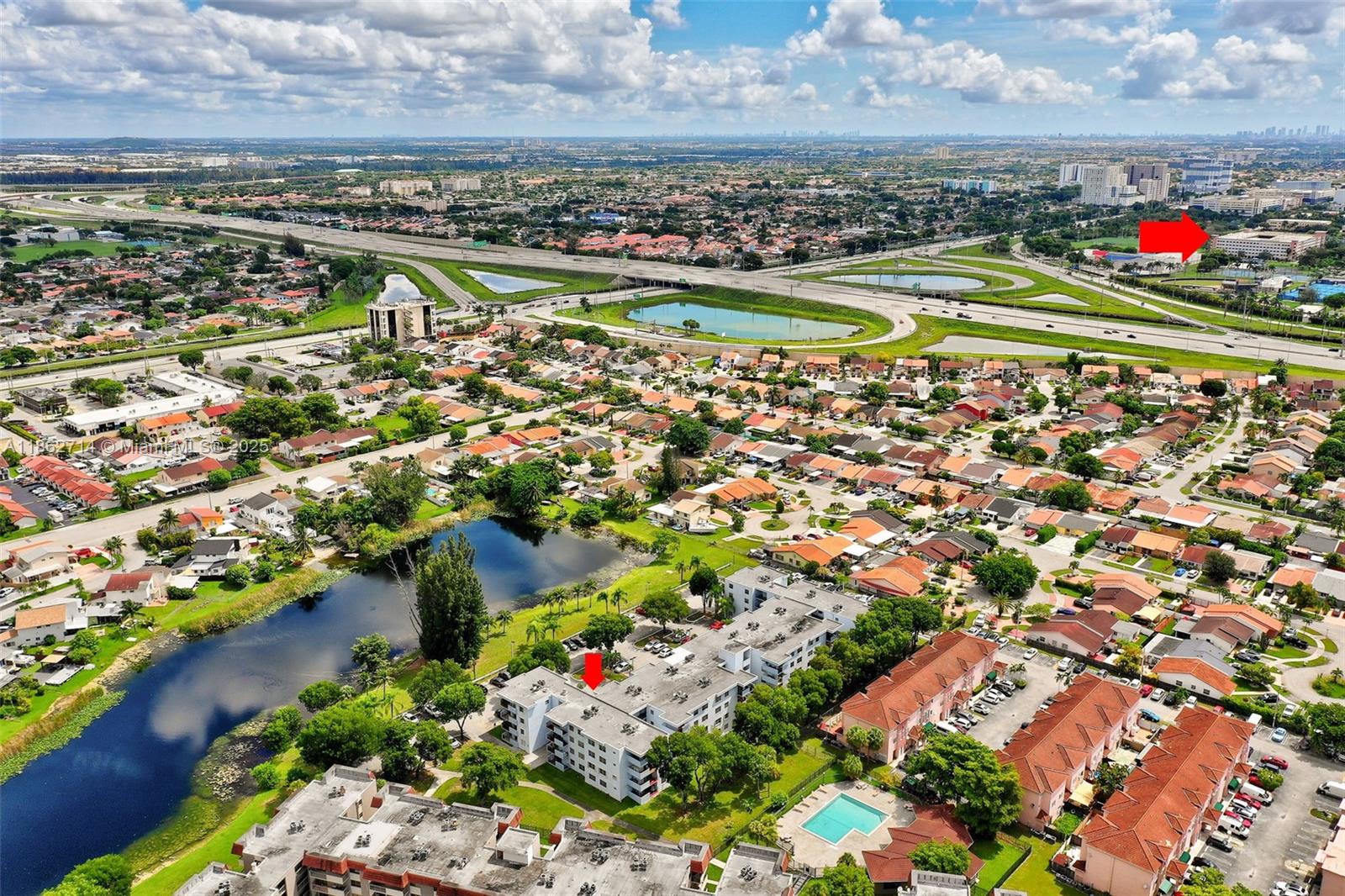 1221 Southwest 122nd Avenue, Unit 215 Miami, FL 33184 - Photo 48 of 57 an aerial view of residential houses with outdoor space and river