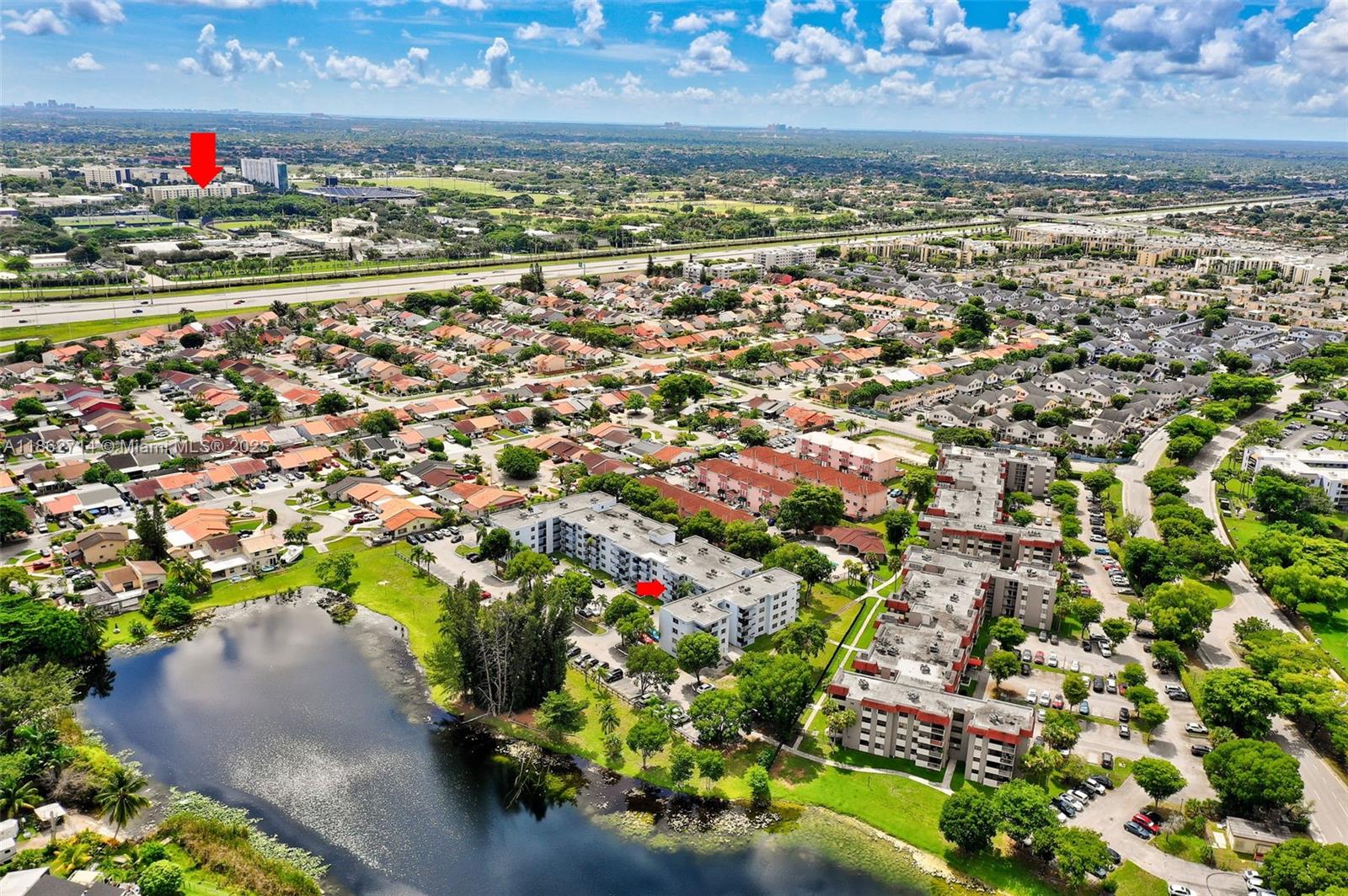 1221 Southwest 122nd Avenue, Unit 215 Miami, FL 33184 - Photo 50 of 57 an aerial view of residential houses with outdoor space