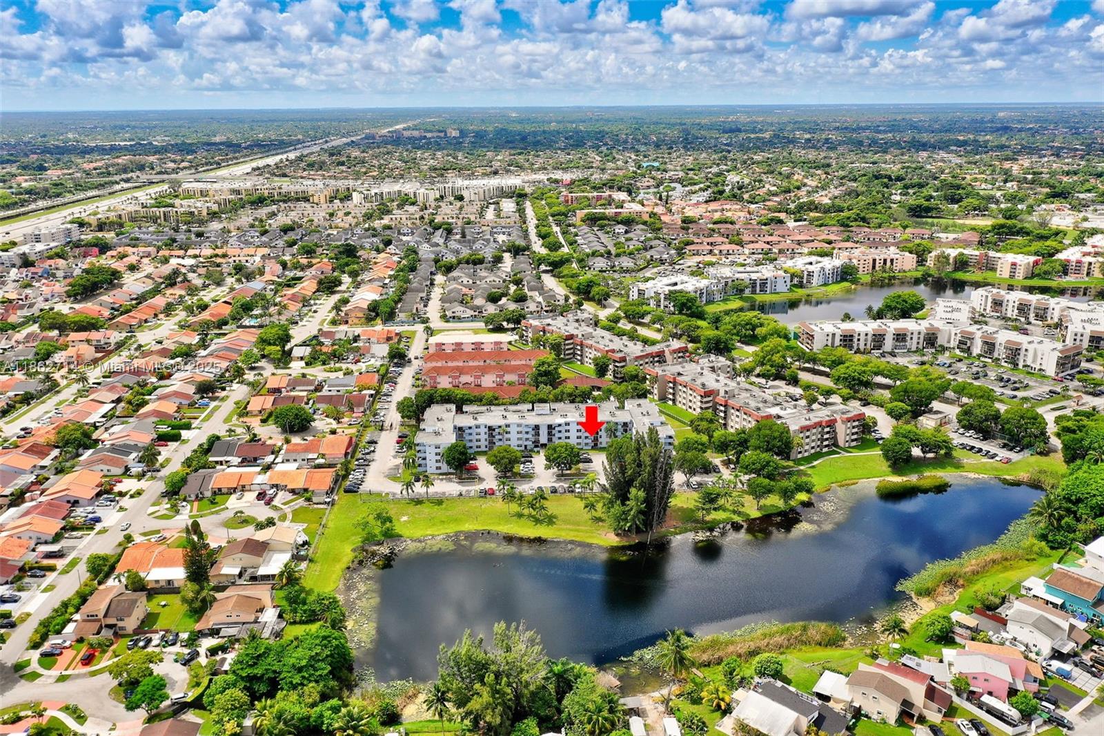 1221 Southwest 122nd Avenue, Unit 215 Miami, FL 33184 - Photo 52 of 57 a view of a city with lots of residential buildings ocean and mountain view in back