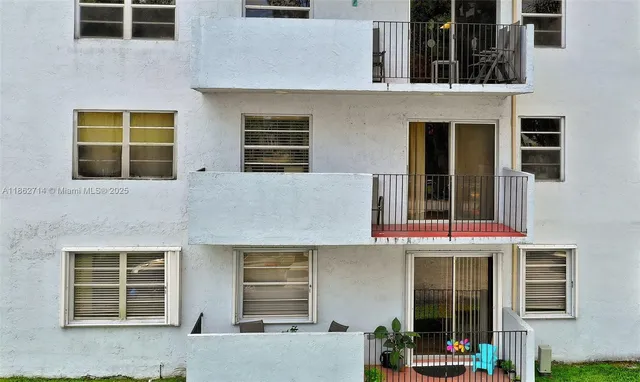 a kitchen with stainless steel appliances kitchen island granite countertop a sink cabinets and microwave