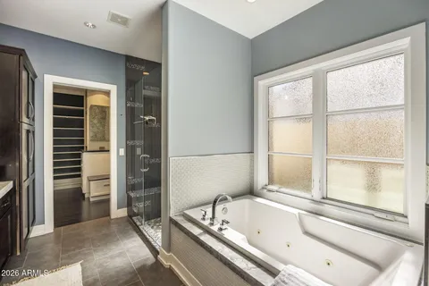 a bathroom with a bathtub and a sink