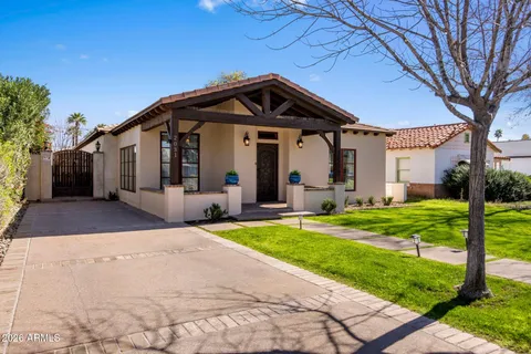 a front view of a house with garden