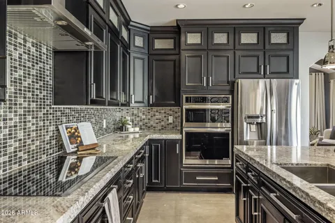 a kitchen that has a sink and a stove