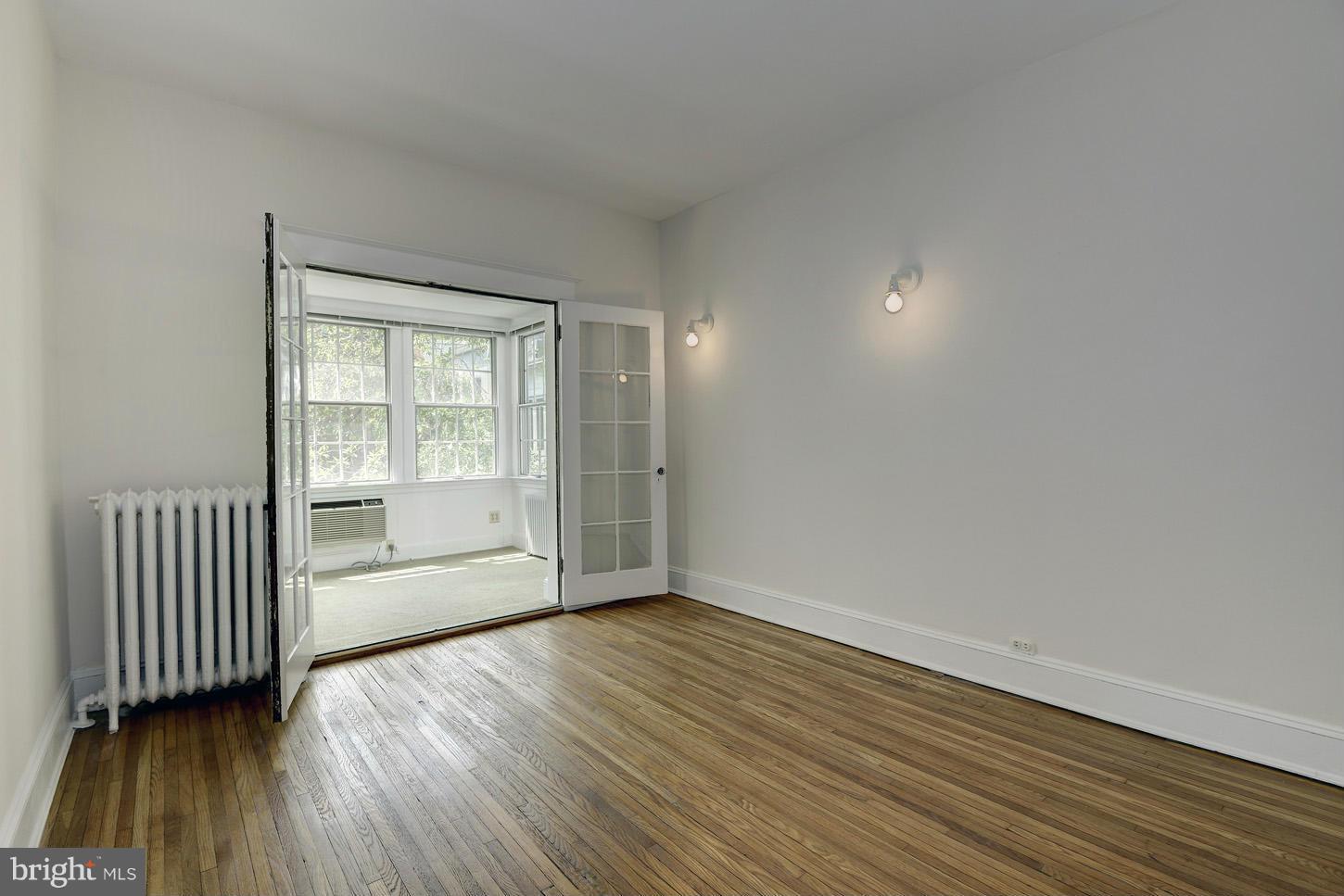 1922 Belmont Road Northwest Washington, DC 20009 - Photo 13 of 20 Bedroom 2 Opens to Sunroom