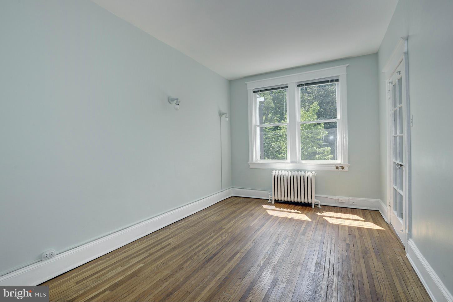 1922 Belmont Road Northwest Washington, DC 20009 - Photo 14 of 20 Bedroom 3 Opens to Sunroom
