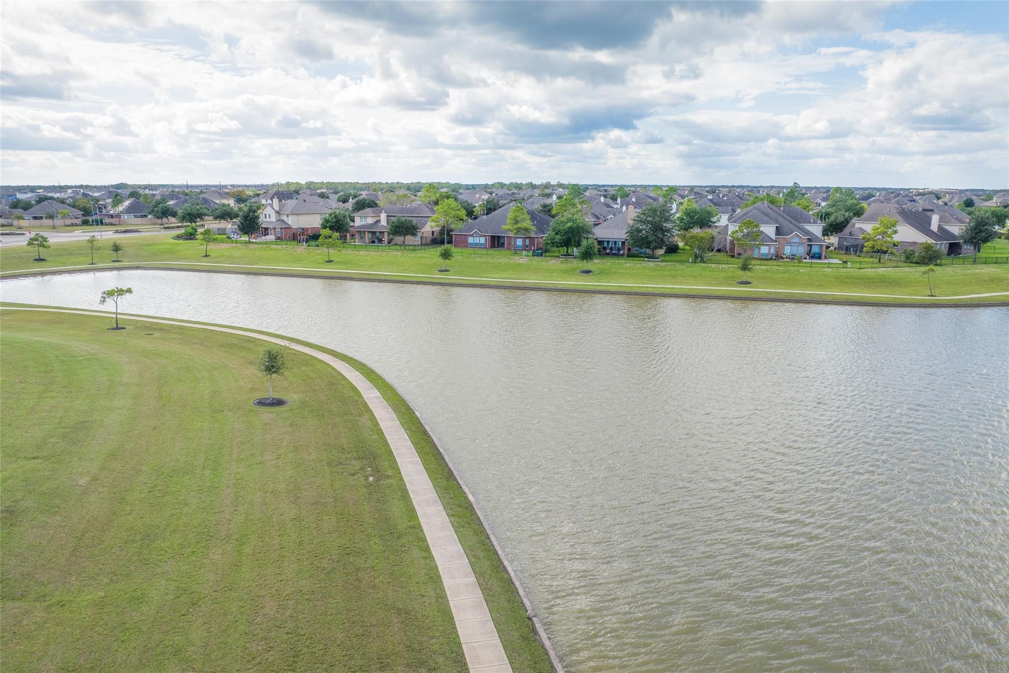 8306 Holly Blue Drive Rosharon, TX 77583 - Photo 25 of 25 a view of a swimming pool and a lake view