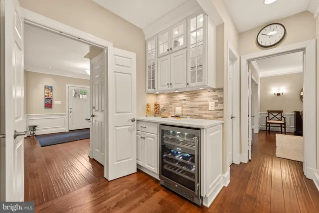 a view of walk in closet with white walls