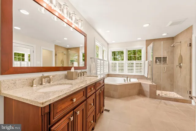 a bed room with a bed and a ceiling fan