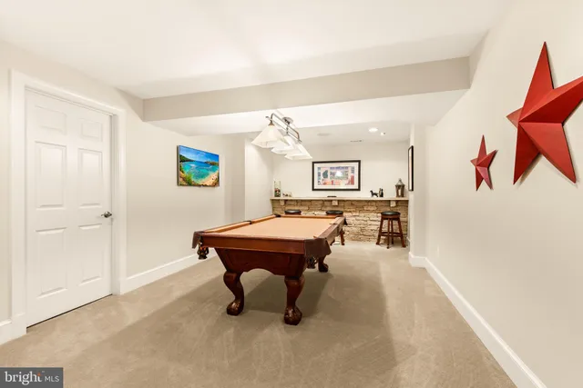 a living room with furniture a table and chairs in it