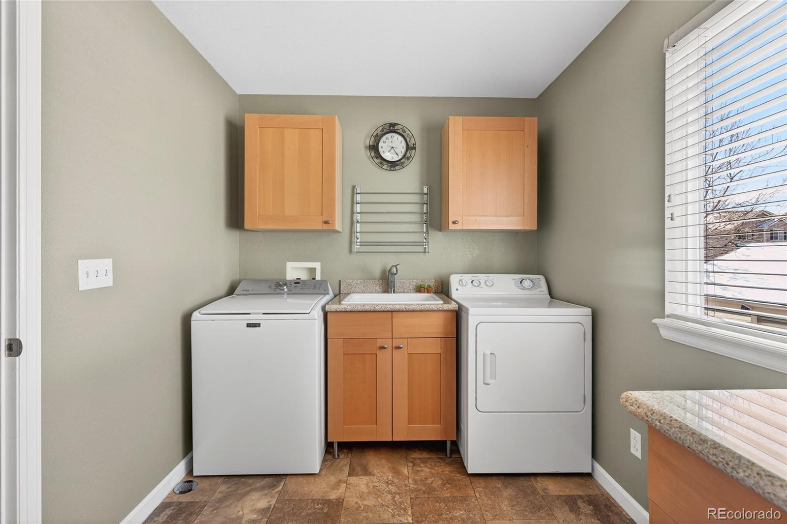 747 West Sparrow Hawk Drive Highlands Ranch, CO 80129 - Photo 11 of 50 a utility room with dryer and washer