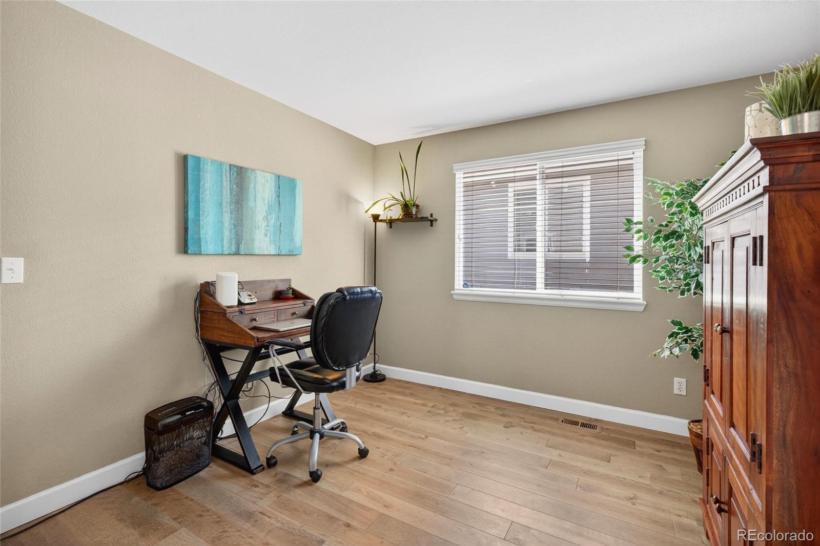 747 West Sparrow Hawk Drive Highlands Ranch, CO 80129 - Photo 15 of 50 a view of workspace with wooden floor windows