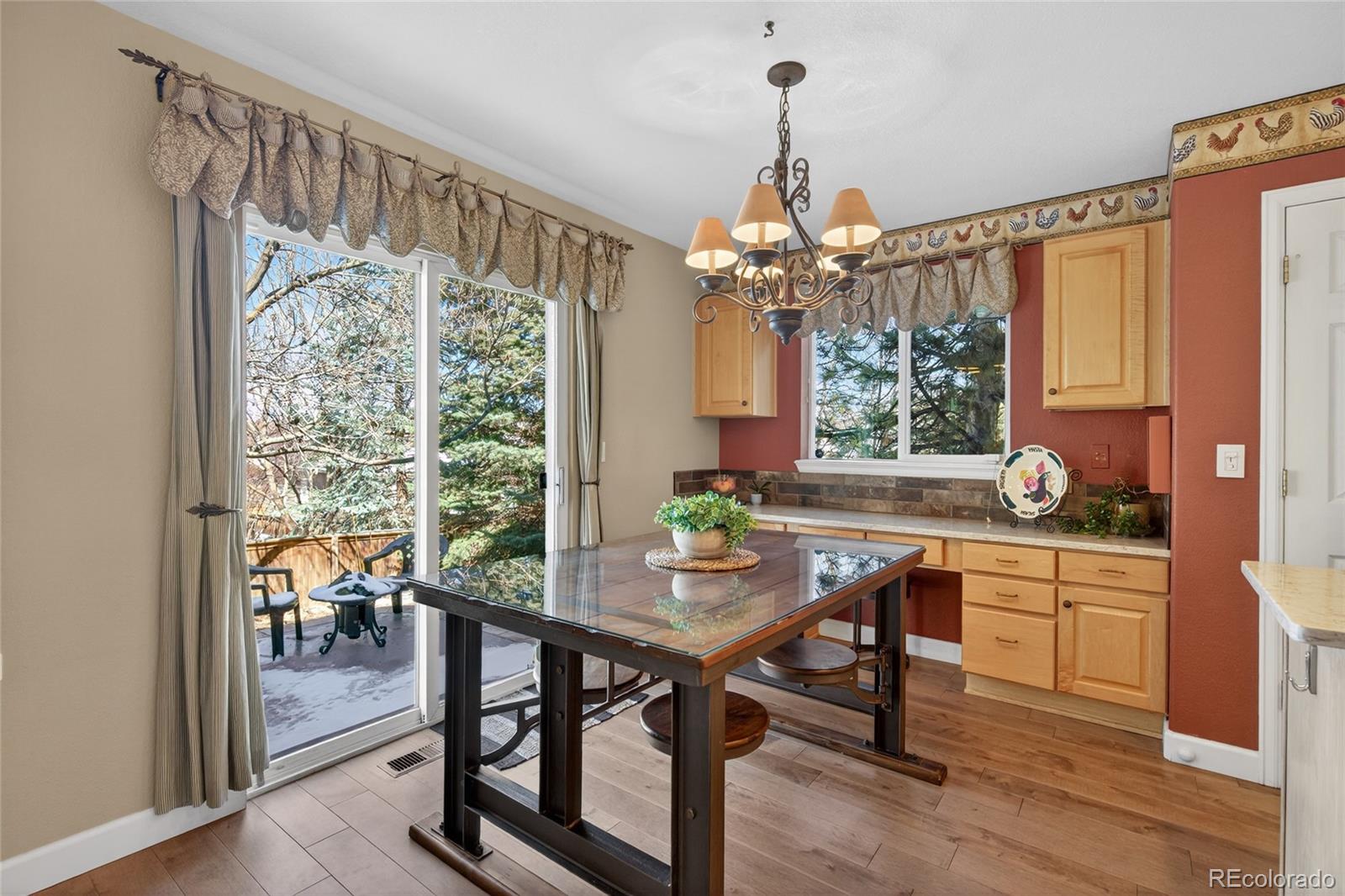 747 West Sparrow Hawk Drive Highlands Ranch, CO 80129 - Photo 17 of 50 a very nice looking dining room with furniture window and outside view
