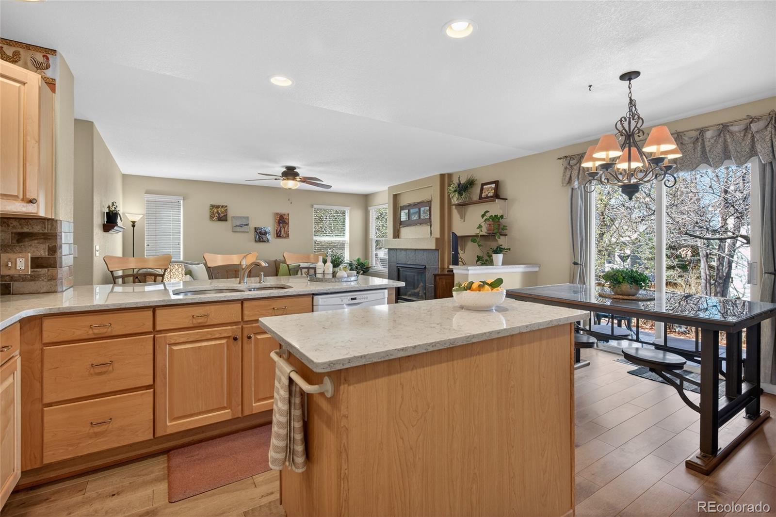 747 West Sparrow Hawk Drive Highlands Ranch, CO 80129 - Photo 18 of 50 a kitchen with sink refrigerator and large window