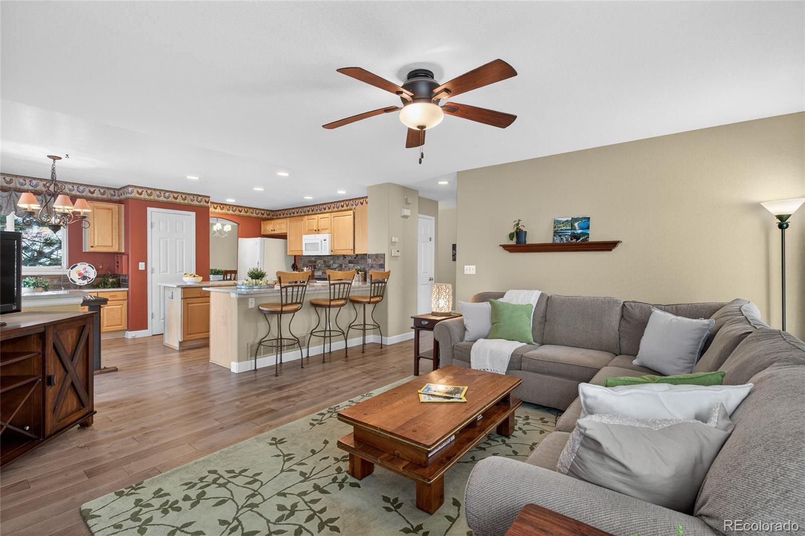 747 West Sparrow Hawk Drive Highlands Ranch, CO 80129 - Photo 21 of 50 a living room with furniture kitchen view and a table