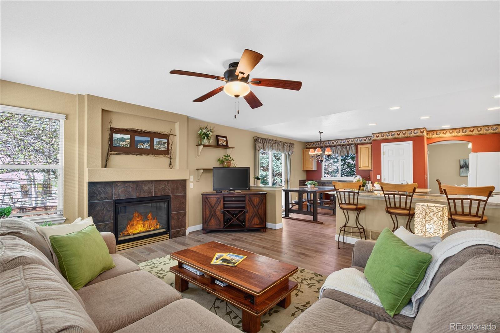 747 West Sparrow Hawk Drive Highlands Ranch, CO 80129 - Photo 22 of 50 a living room with furniture and a fireplace