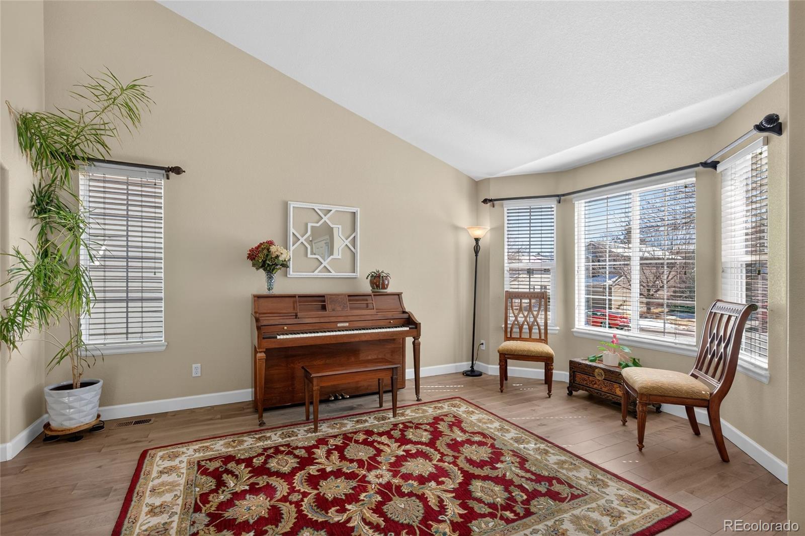 747 West Sparrow Hawk Drive Highlands Ranch, CO 80129 - Photo 25 of 50 a living room with furniture and a window