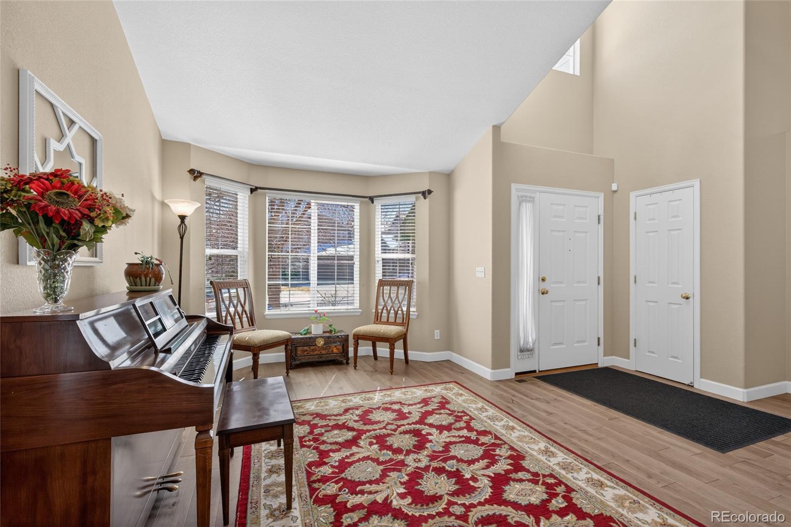 747 West Sparrow Hawk Drive Highlands Ranch, CO 80129 - Photo 26 of 50 a living room with furniture and wooden floor