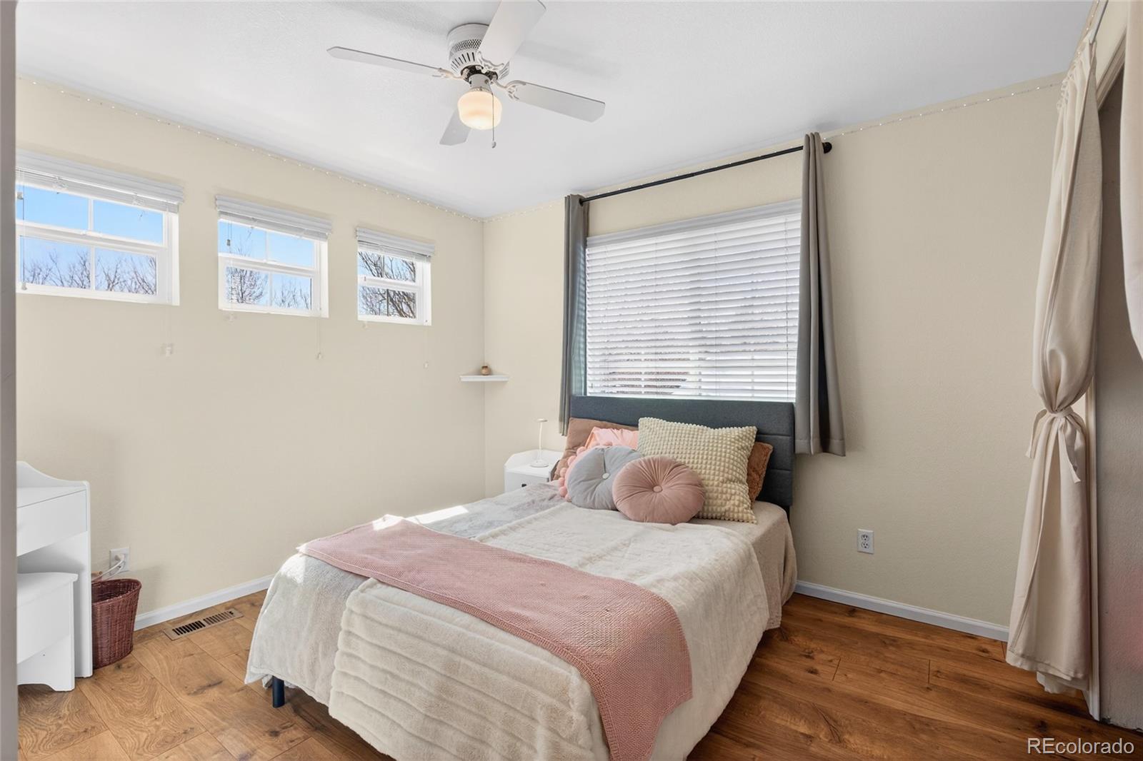 747 West Sparrow Hawk Drive Highlands Ranch, CO 80129 - Photo 31 of 50 a bedroom with a bed and a window