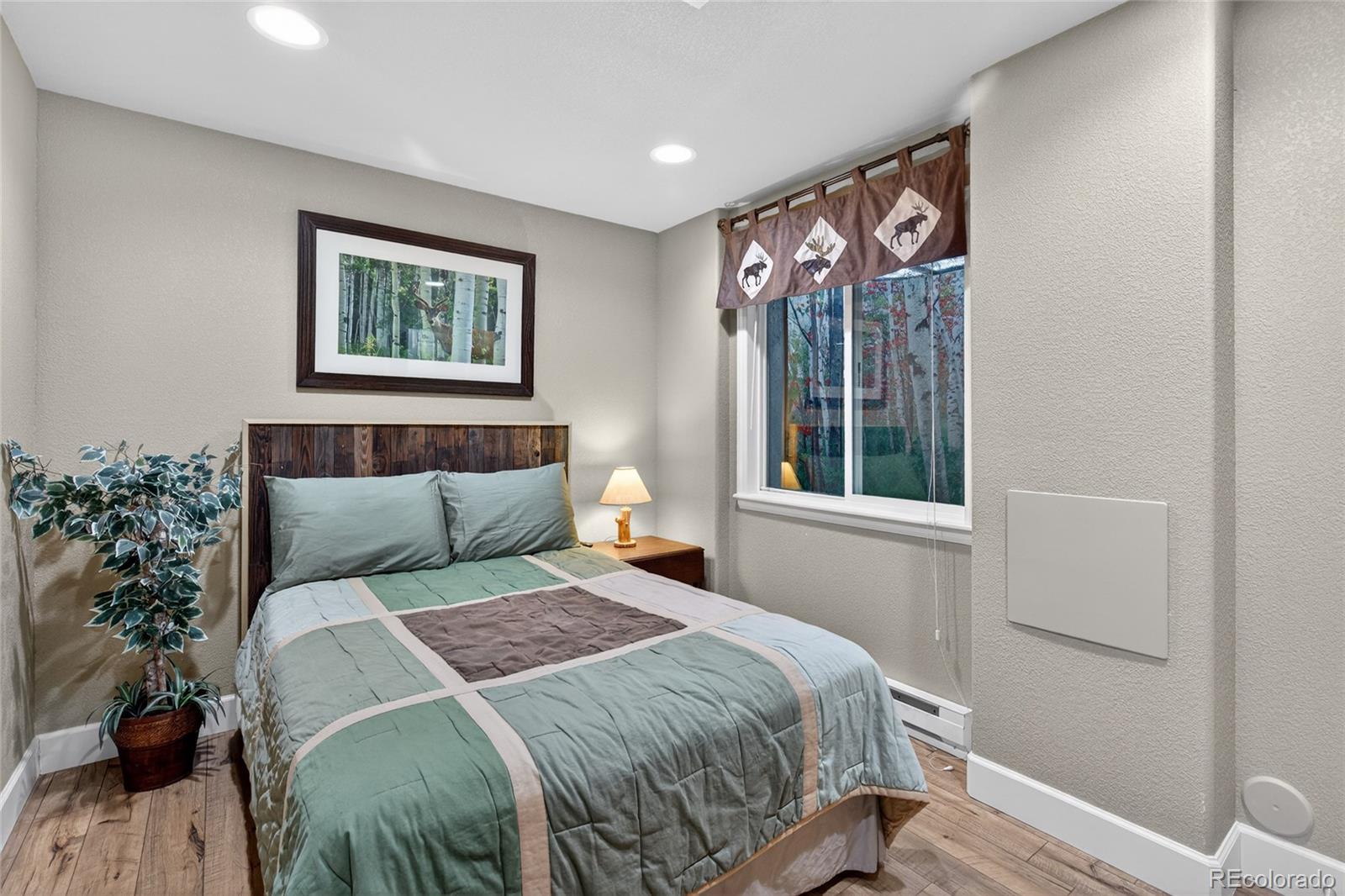 747 West Sparrow Hawk Drive Highlands Ranch, CO 80129 - Photo 36 of 50 a bedroom with a bed and a window
