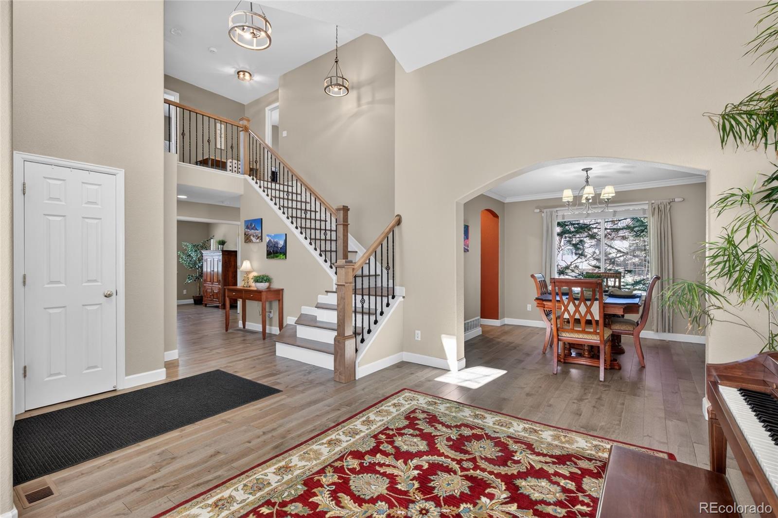 747 West Sparrow Hawk Drive Highlands Ranch, CO 80129 - Photo 4 of 50 a living room with furniture and a wooden floor