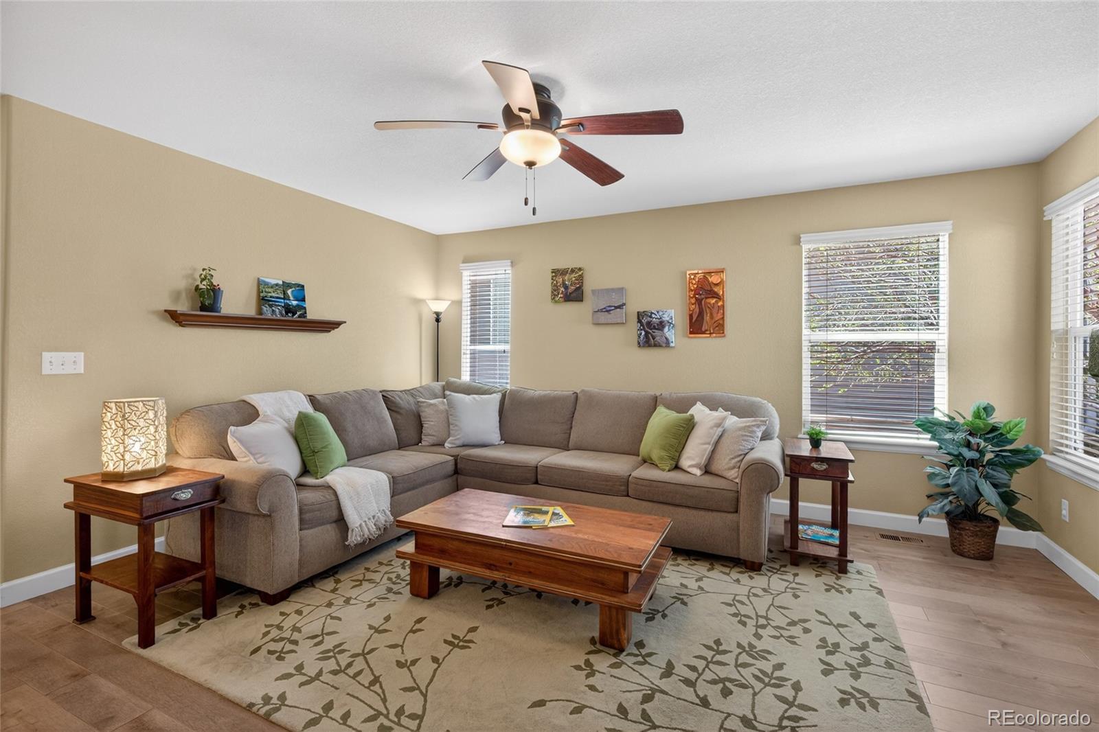 747 West Sparrow Hawk Drive Highlands Ranch, CO 80129 - Photo 6 of 50 a living room with furniture a rug and a window