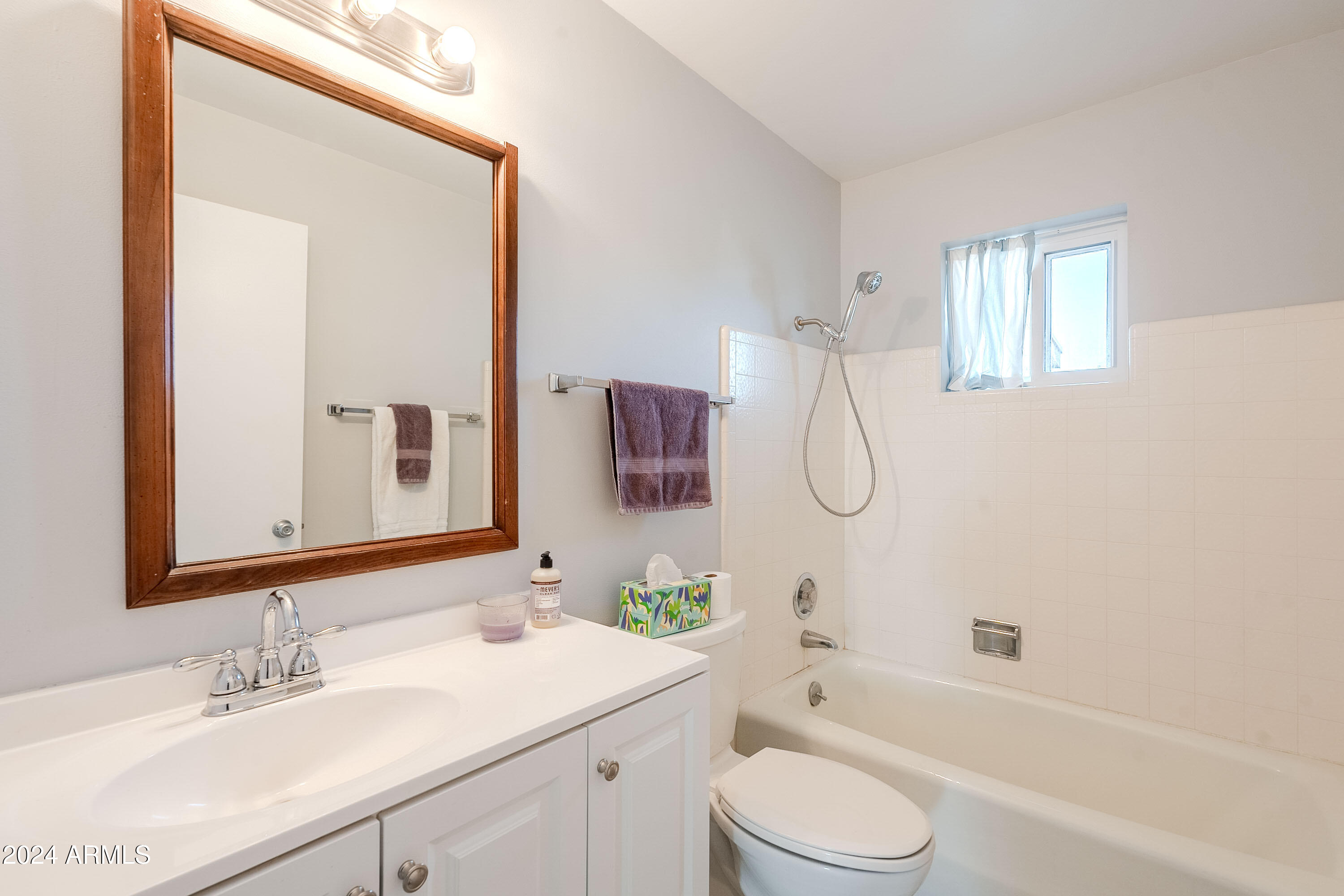 5914 East Decatur Street Mesa, AZ 85205 - Photo 13 of 37 a bathroom with a sink toilet vanity and shower