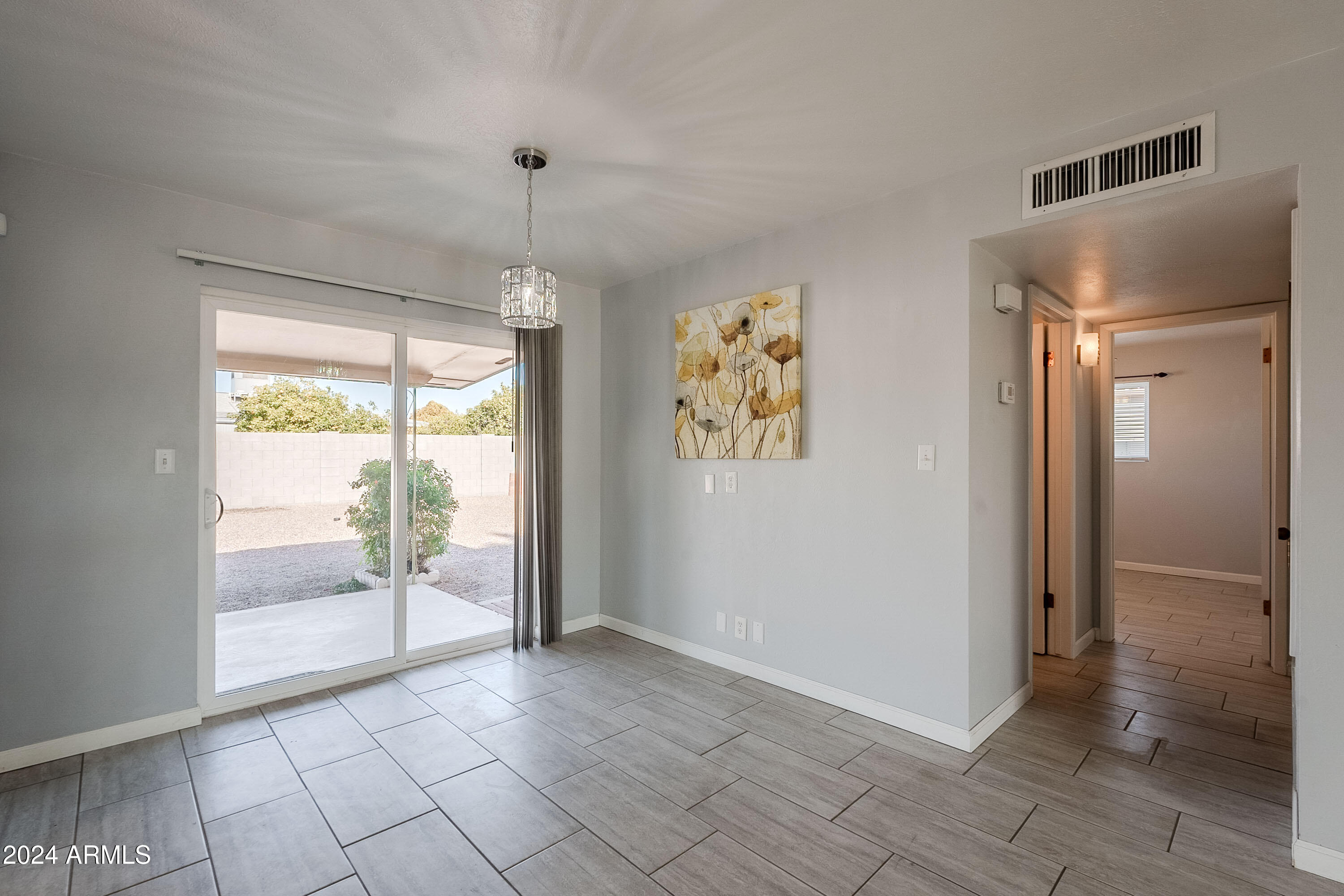 5914 East Decatur Street Mesa, AZ 85205 - Photo 27 of 37 a view of an empty room with glass door