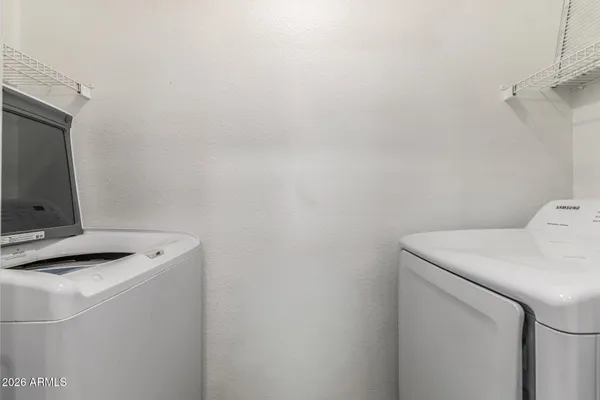 a utility room with dryer and washer