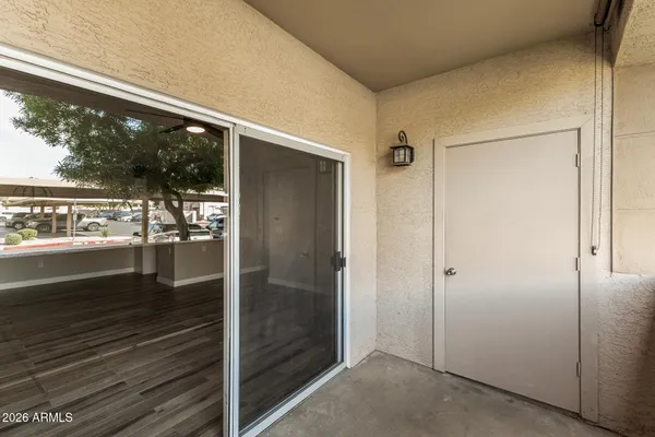 a bathroom with a glass shower door and a window