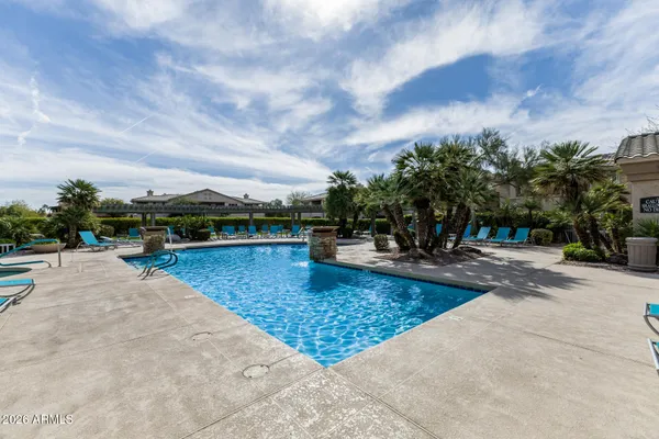 a view of a swimming pool with a patio