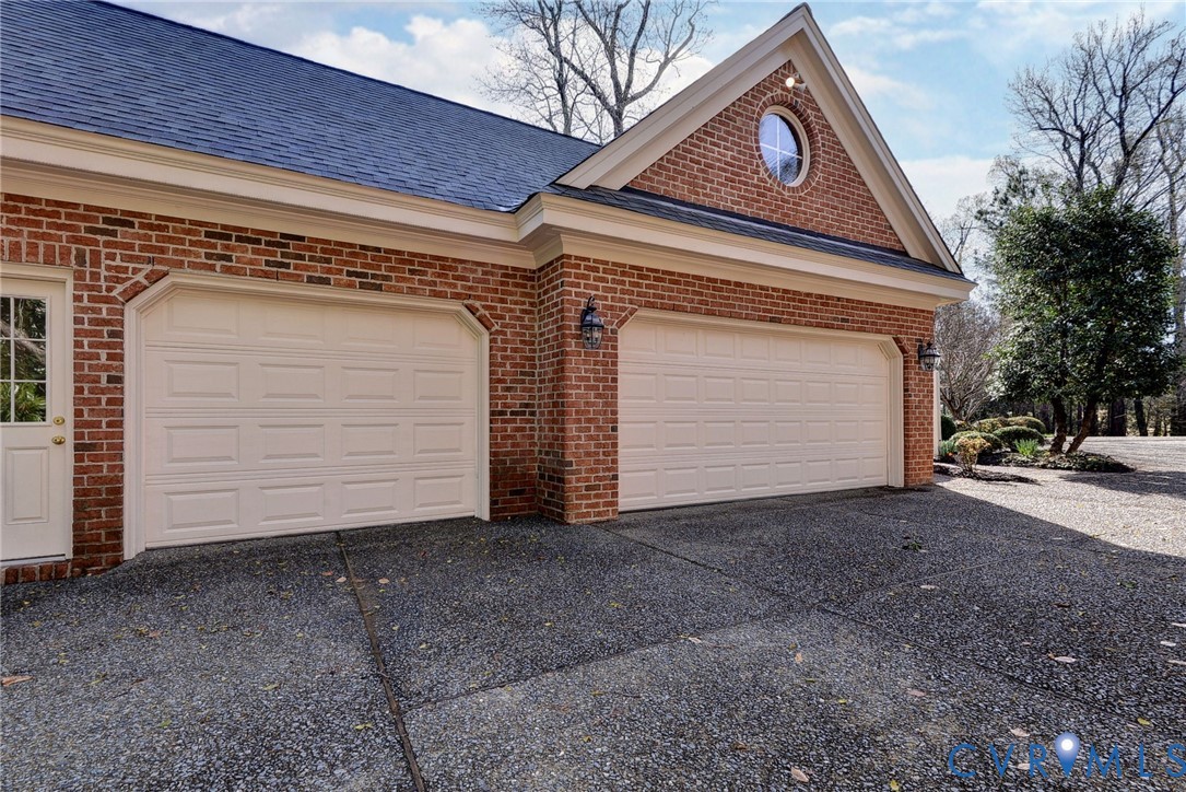 1613 River Ridge Williamsburg, VA 23185 - Photo 3 of 82 Garage featuring driveway