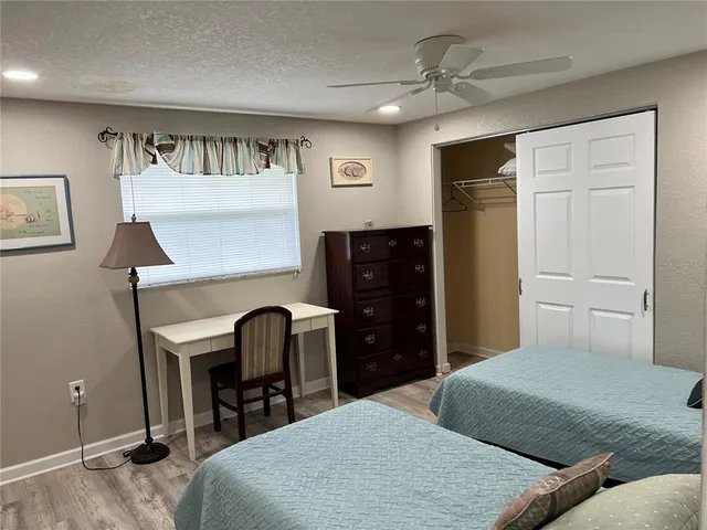 a bedroom with a bed and a table