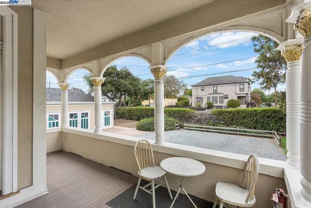 a view of a patio with table and chairs and potted plants