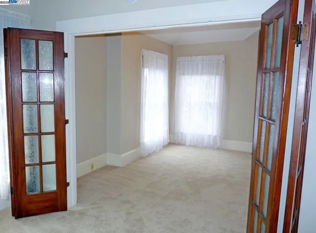 a view of an empty room and window