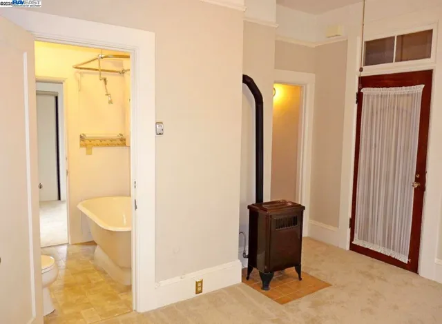 a bathroom with a bathtub and a toilet