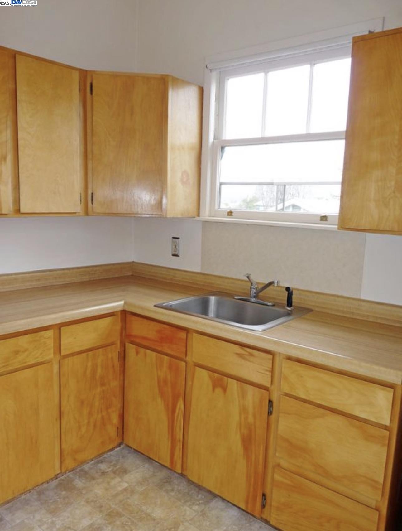 1606 Morton Street Alameda, CA 94501 - Photo 3 of 48 a kitchen with a sink and cabinets