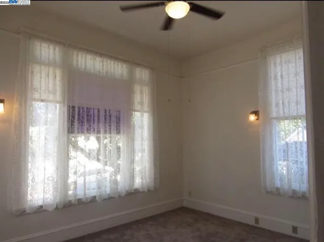 a kitchen with a sink a refrigerator and window