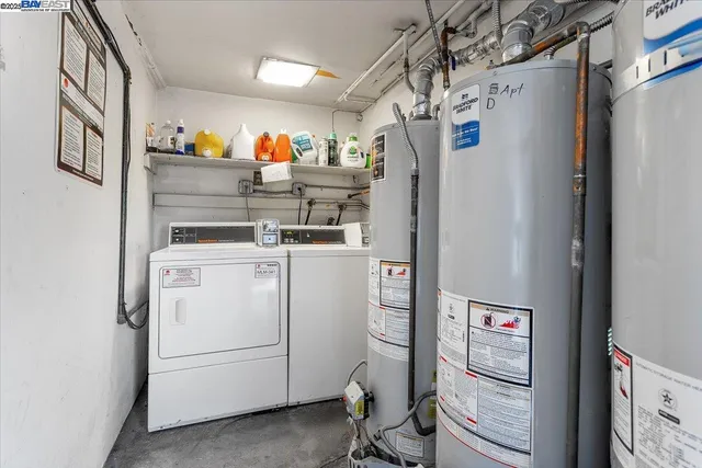 a view of a hallway with washer and dryer
