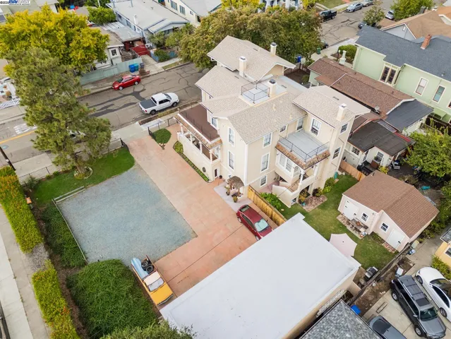 an aerial view of residential houses with outdoor space